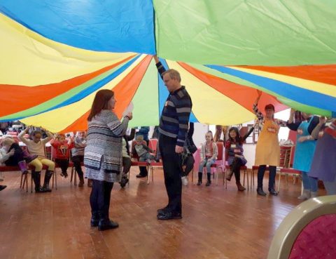 Under the parachute in messy church