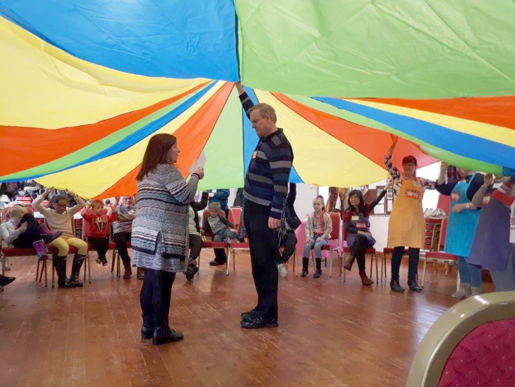 Under the parachute in messy church
